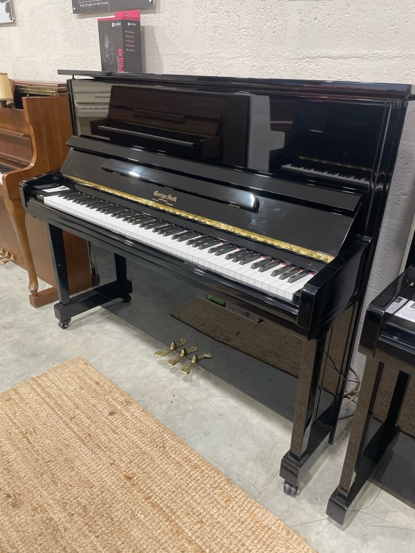 Acheter un piano acoustique d'occasion équipé d'un système silencieux pour jouer au casque et à un petit prix, de la marque Georges STECK US22